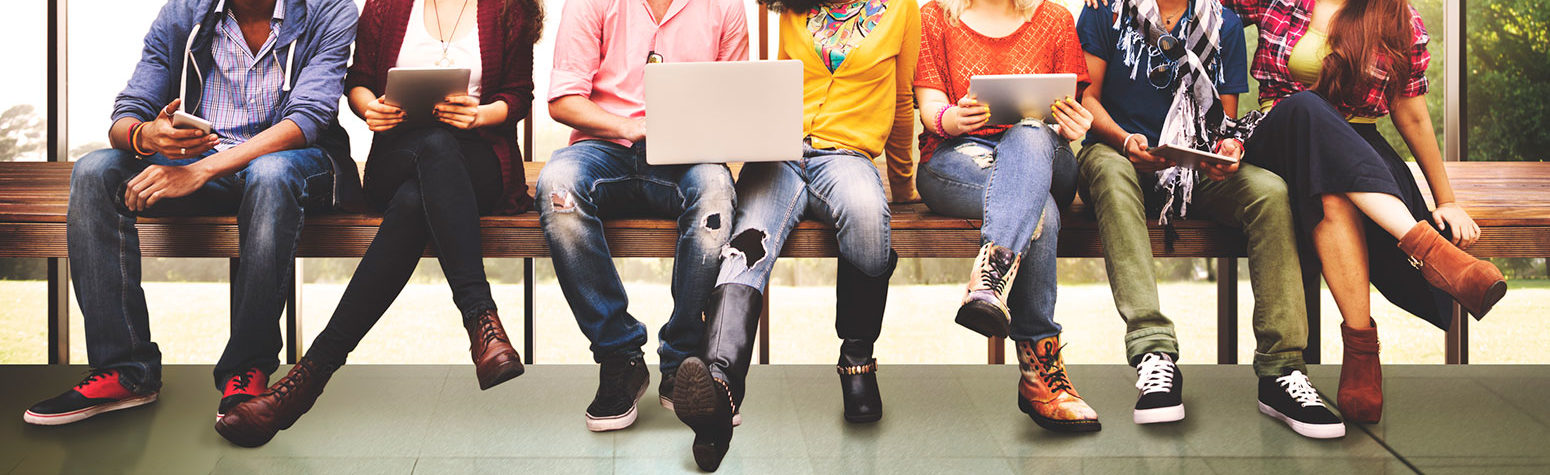 smiling diverse group of men and women sitting together