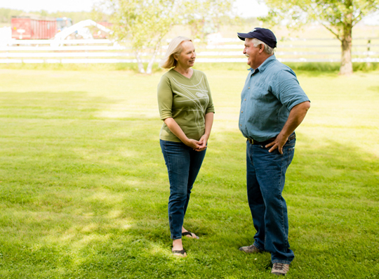 old couple talking in the yard