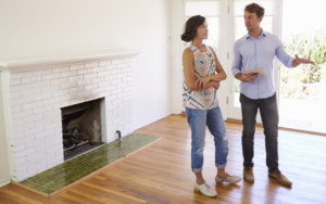 A man talking to a woman buyer of the house