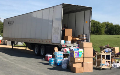 Semi truck being loaded with boxes for Hurricane Harvey