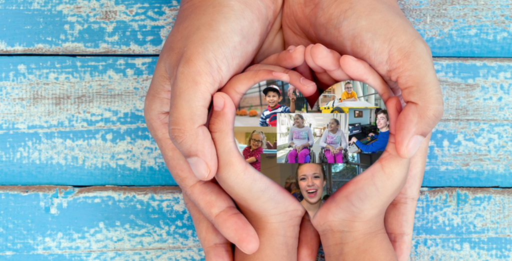 Adult hands and youth hand together holding a heart of images