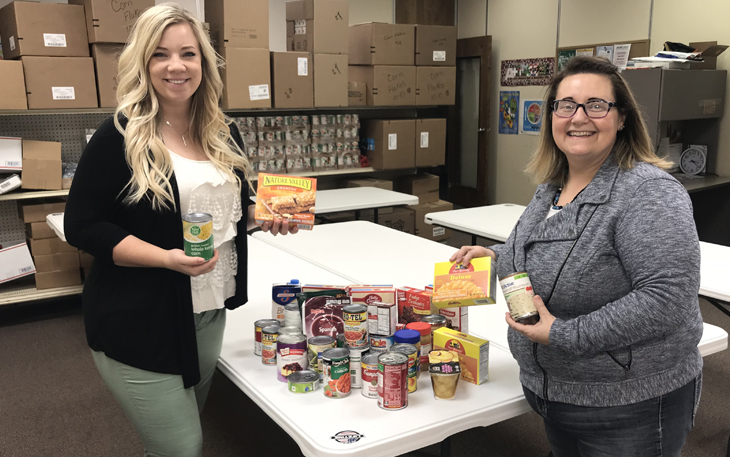 People donating food to a food shelf