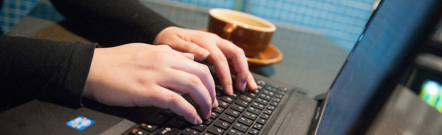 Man typing on a laptop