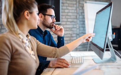 Man and female working on a computer together.