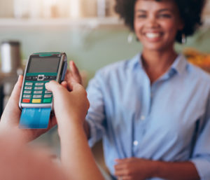 Lady paying for items using a chip card.