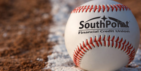 Baseball on ground with SouthPoint logo on it.