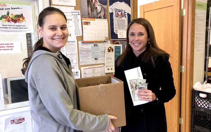 Megan Karg provides donation to McLeod Emergency Food Shelf