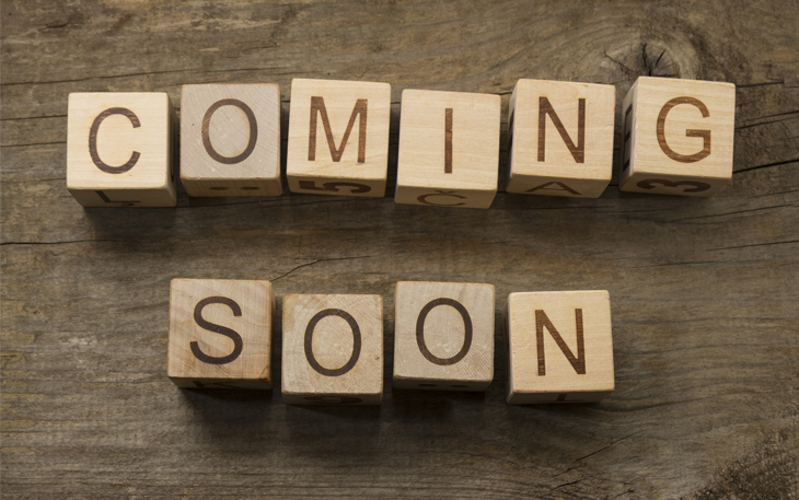 Wooden blocks spell out "Coming soon."