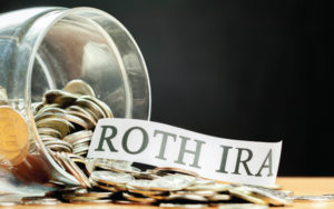 Jar of change with the words Roth IRA in paper