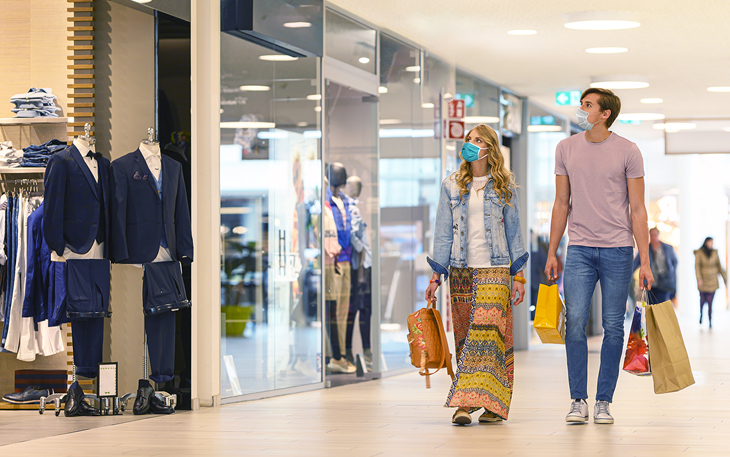 Couple walking in mall shopping