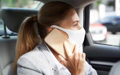 Lady talking on phone while in a car