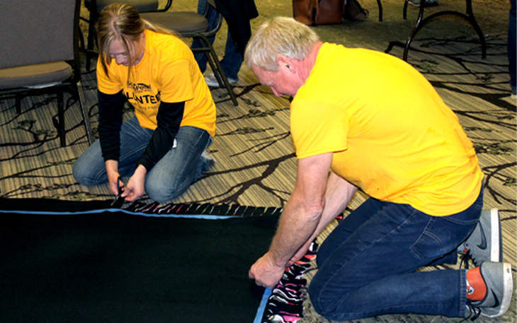 SPFCU staff tie blankets during CU Forward Day