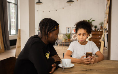 Father talking to his daughter about budgeting