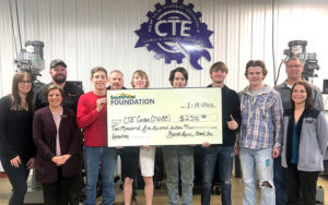 New Ulm Branch President Maxine Meine, front row left, delivers a $2,500 check to the District 88 CTE Center on behalf of the SouthPoint Foundation.