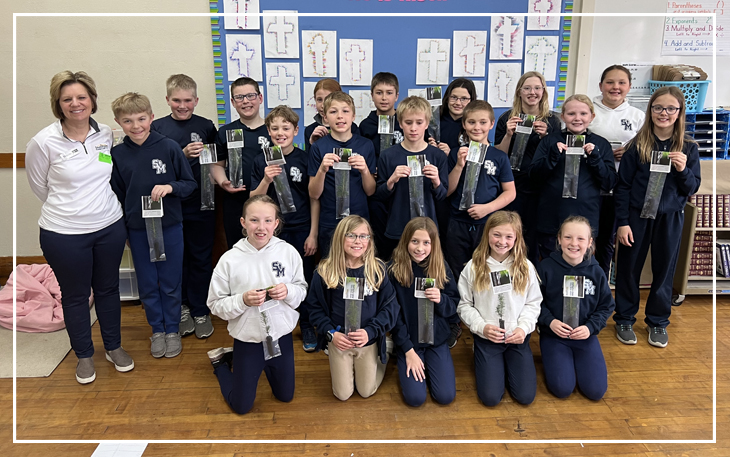 classroom with tree saplings for Arbor Day